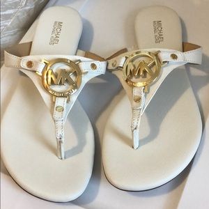 MICHAEL KORS white thong sandal, gold trim.
